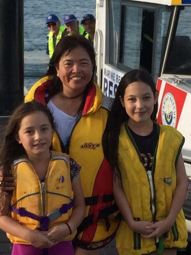 Samantha Lawson, Eva Arambala and Tia Lawson, safely back on shore after their Hobie Cat capsized, with rescue crew members Kevin Bailey, John Peers and Aaron Orton © Ken McManus